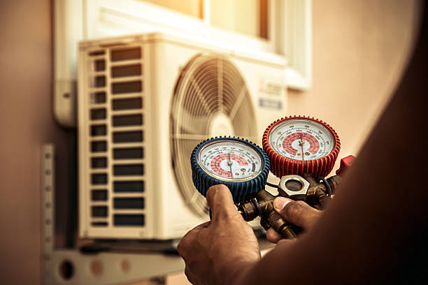 Professional Heat Pump Repair technician working in Bloomington, TX